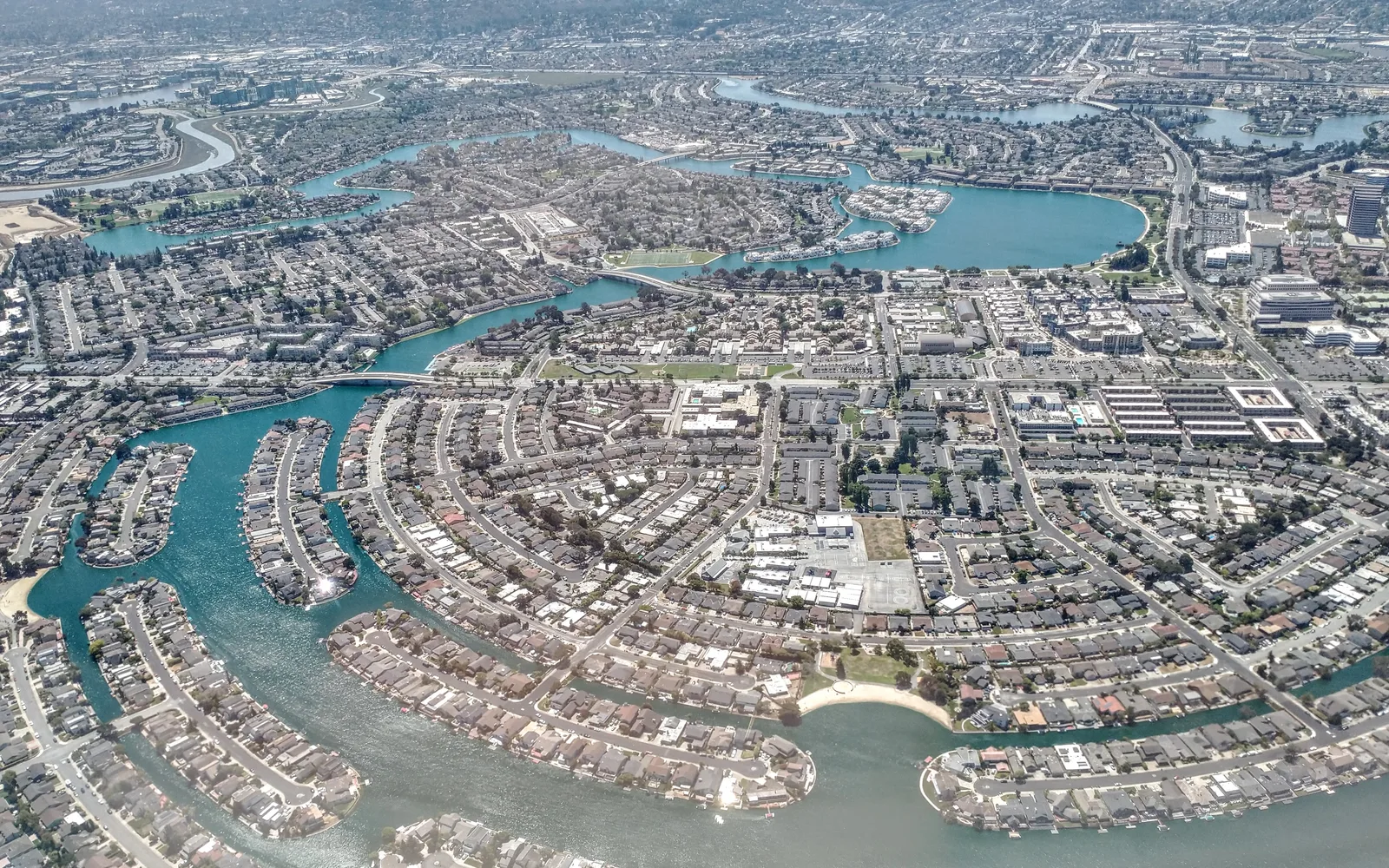 Aerial view of a residential neighborhood showing houses and tree-lined streets in Foster City, California